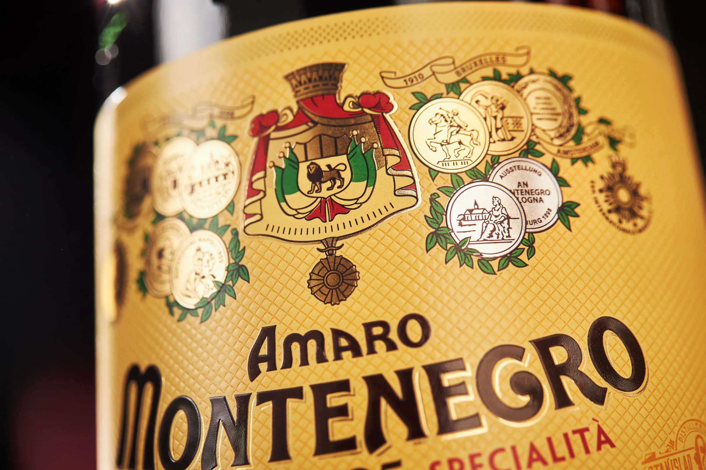 Extreme close-up of an Amaro Montenegro bottle label — Bologna
