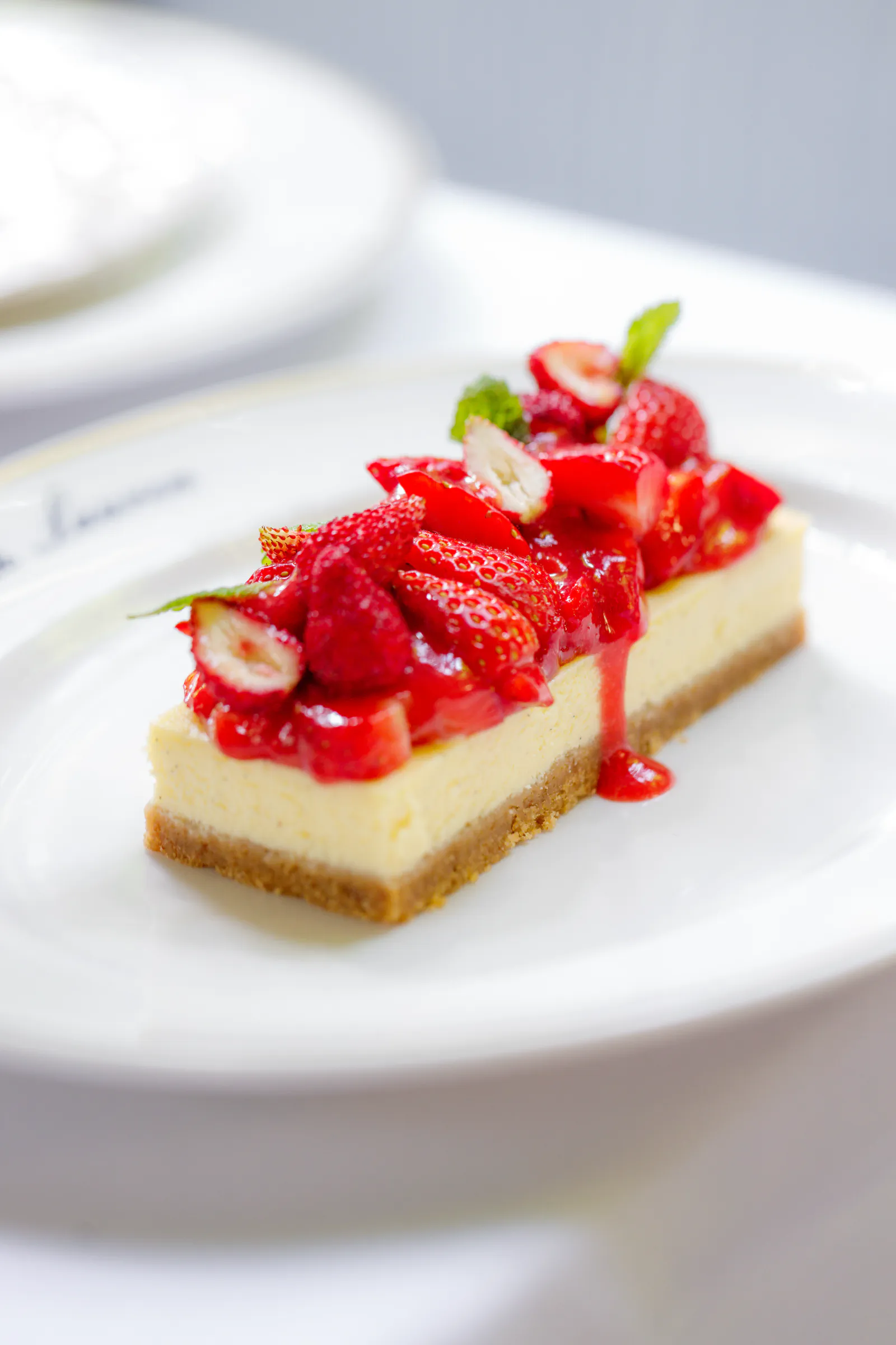 Strawberry cheesecake slice topped with fresh strawberries - The Bar by Ralph Lauren, Milan, Italy