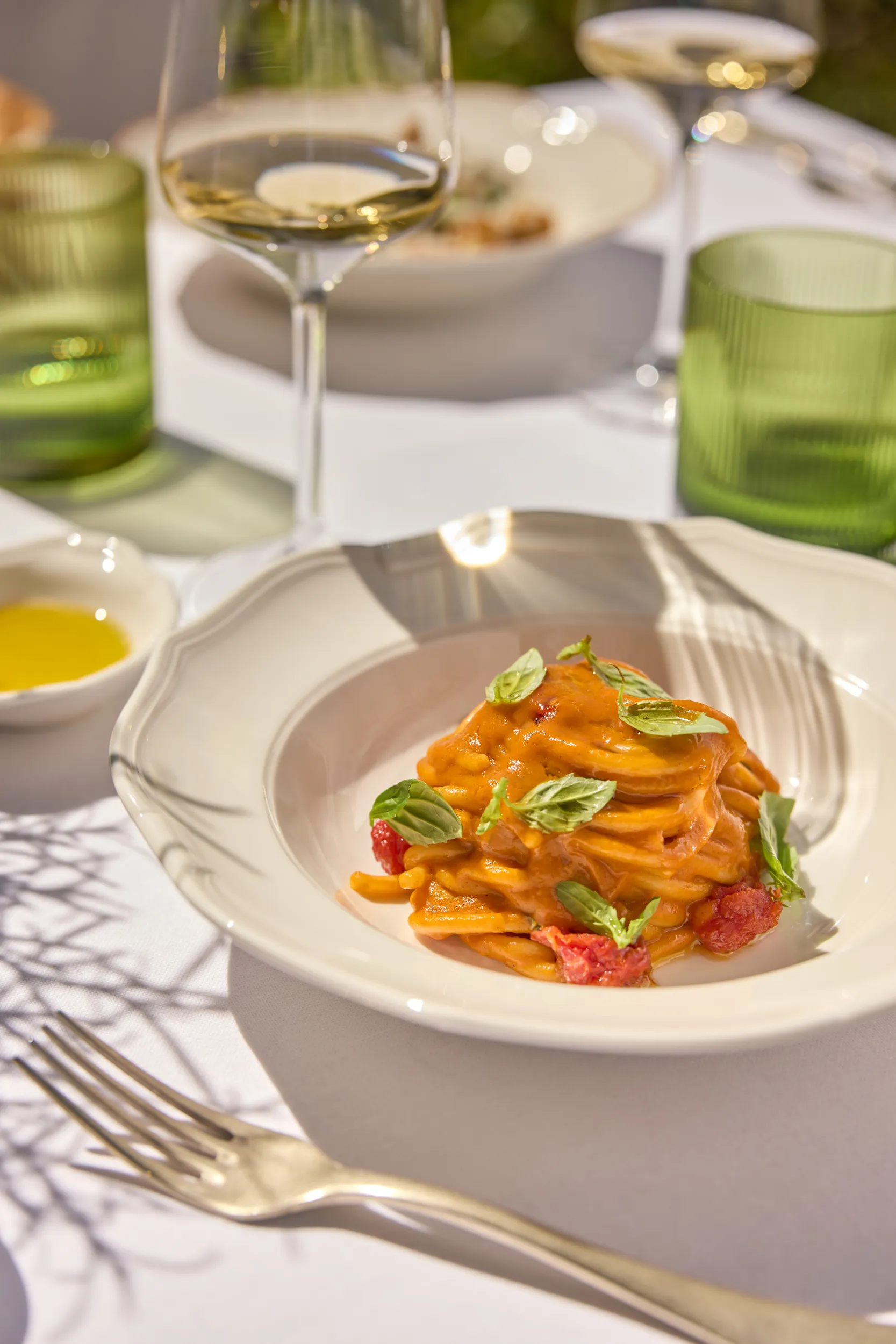 Spaghetti al pomodoro with basil on a white plate - Collegio alla Querce, Florence, Italy