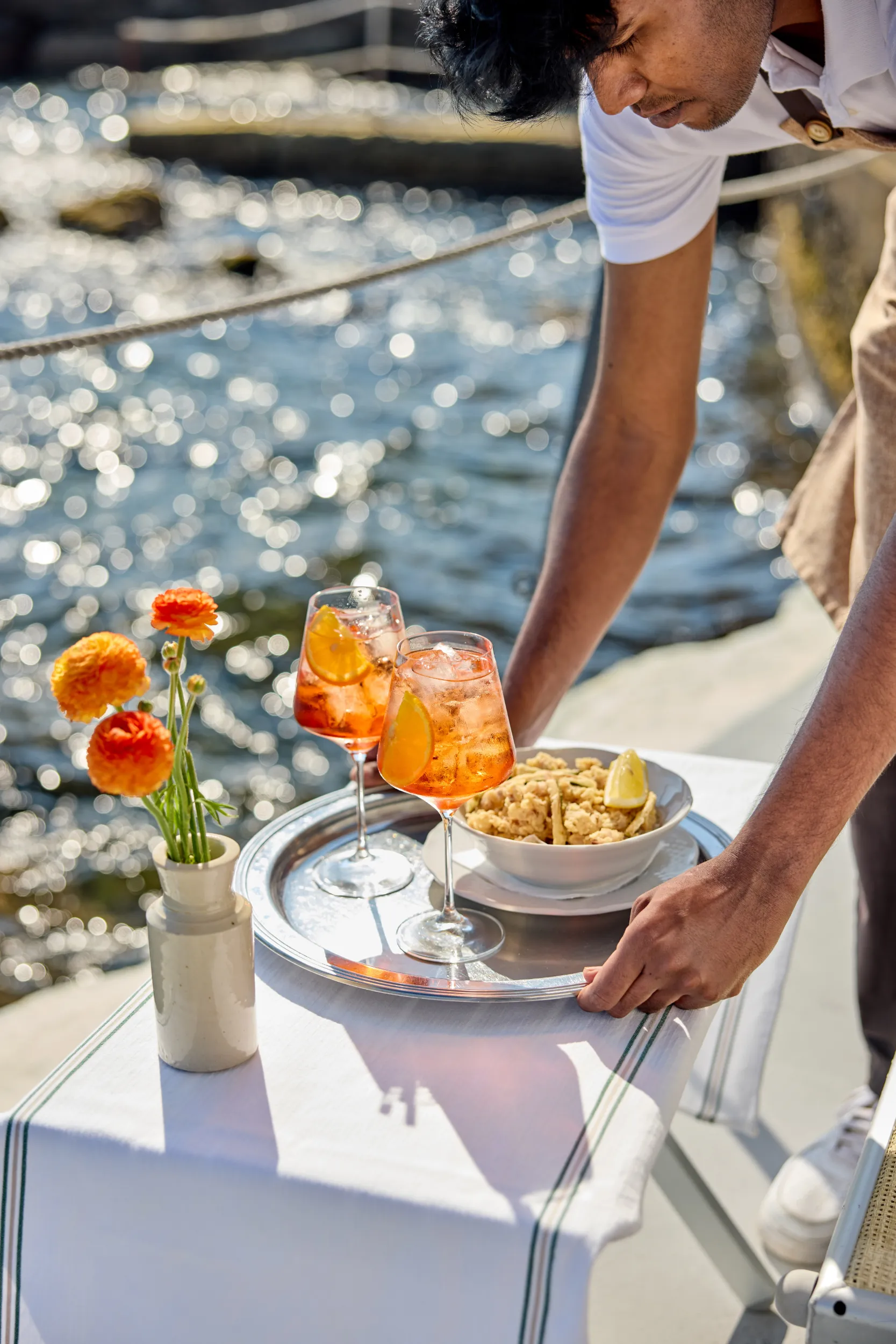 Seaside aperitivo of spritz and fried squid being served - Bianca Restaurant, Santa Marinella, Italy