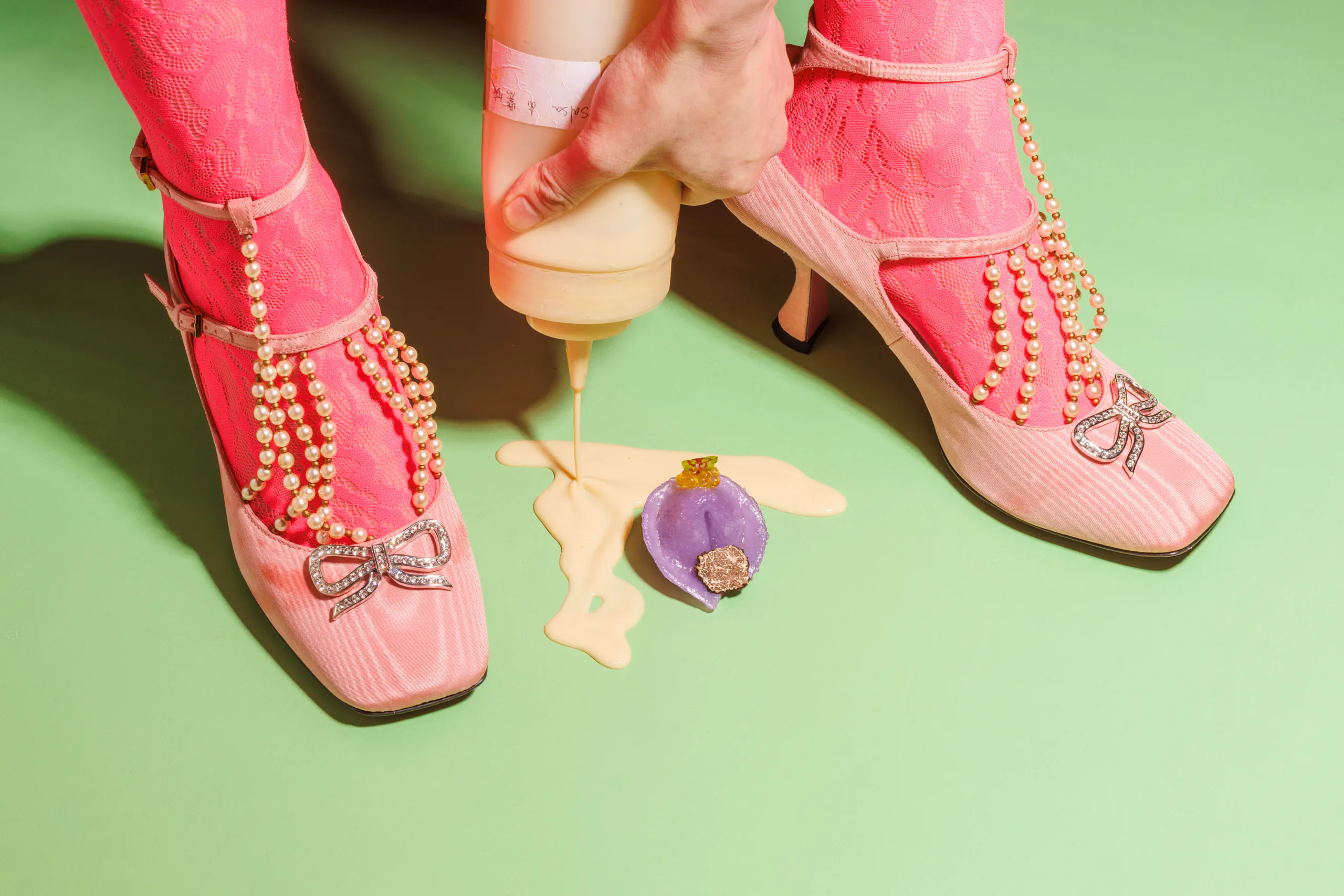 Playful editorial still life with pink heels and a dim sum bite - Il gusto di Xin Ge, Florence, Italy