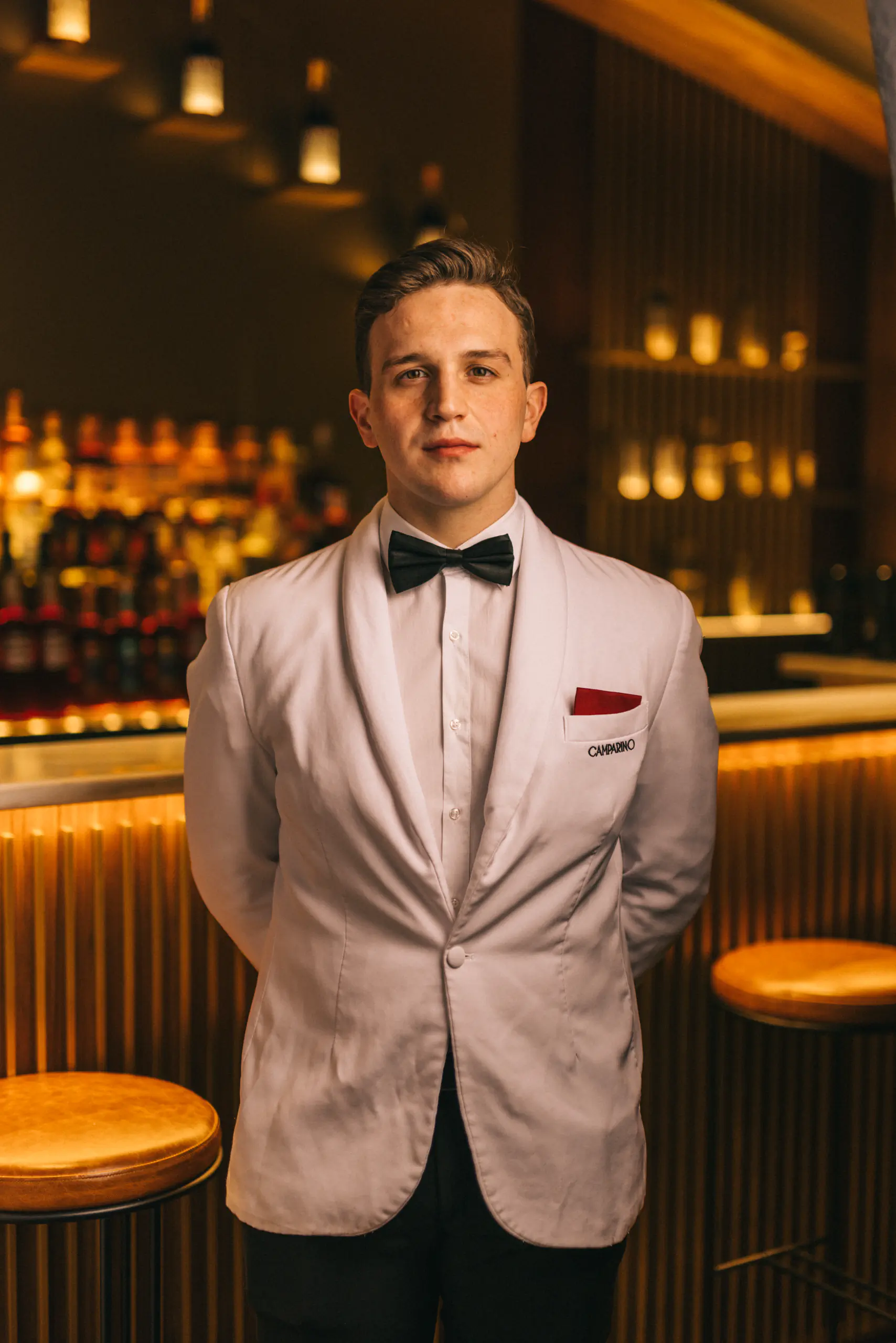 Bartender in a white tuxedo at an elegant bar — Camparino in Galleria, Milan